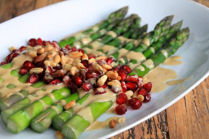 Asparagus Salad with Pomegranate, Toasted Pine Nuts and a Tahini-Lime Sauce